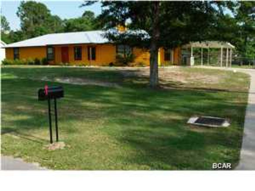 Great house in excellent location for a growing family or someone that needs room to play. This home features 4 bedrooms & 2 baths with a large bonus room that could be used as a 2nd living area or game room. This home has been meticulously maintained by the owner and needs nothing. You will love the screened back porch, detached garage/workshop(with water and electric), 30 Amp RV outlet, fenced in backyard with gardening area, irrigation, and a greenhouse. Be sure to check out the Walk-In Tub with self-cleaning, stainless steal air hydrotherapy jets. This home is very close to Bay Dunes Golf Club and is a must see! Call today to get a list of all the recent updates and to schedule a viewing. Possible Owner Financing Available with a minimum of 10% down. All info and measurements