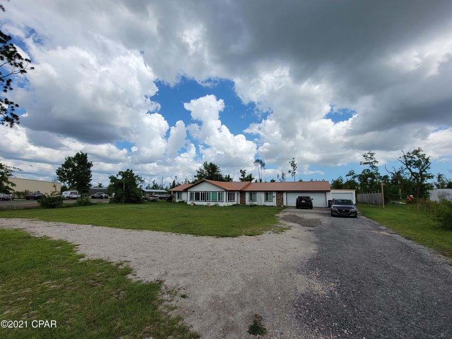 Great R2 Commercial Residential Opportunity right on HWY 390 in a prime location. Close to schools, shopping and more. This huge 4/3 sits on over an acre with its own Pond.  Perfect place for a home based business, or a growing enterprise. It has a new Metal roof installed in 2019, New windows installed in 2020, as well as garage door. Step into a huge additional room that could be used as an Office front or showroom. The living room is large and has a great fireplace. The bedrooms are good sized. The Master is very large and has a huge master bath. The Dinning area is very expansive and the open Kitchen gives you plenty of space for entertaining. The back yard has a built in Pavilion style seating area overlooking the pond. Contact an agent today for your private tour.