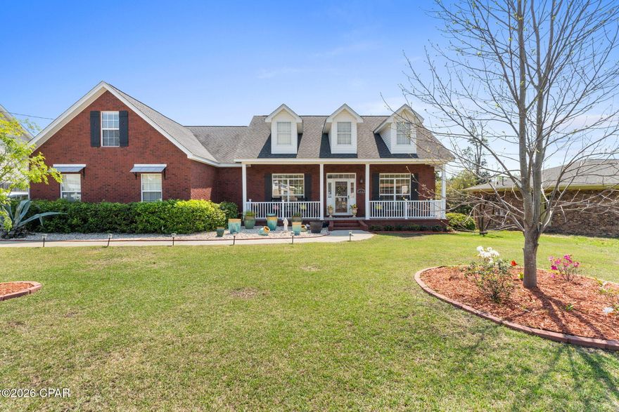 Custom-built, this beautifully maintained all-brick home offers exceptional curb appeal and a prime location just steps from the new Al Helms Dog Park, Garden Club, and a short walk to the Bay and Beach Drive. Conveniently located between St. Andrews and downtown, with quick access to 23rd Street shopping and the beaches. Inside, you'll find a well-appointed gourmet kitchen featuring KitchenAid stainless steel appliances, double convection ovens, gas cooktop, custom maple cabinetry, solid surface countertops, and a built-in breakfast nook. The open layout is enhanced by 10-foot ceilings, crown molding, recessed lighting, bamboo flooring, and a gas fireplace. Built with quality in mind, upgrades include plywood construction (no OSB), all-brick stem wall, 30-year architectural shingles, and wind-rated garage doors. The home offers abundant storage with an oversized two-car garage, climate-controlled storage room, and a detached 26x14 workshop with 100-amp service and attic space. Enjoy outdoor living with covered front and back porches, a spacious deck for entertaining, and an extra-wide driveway with room for a boat or RV. A rare combination of quality, location, and functionality.