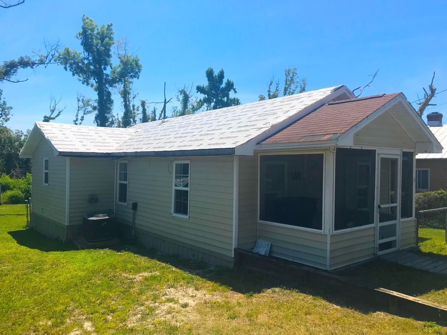 SUPER fix & flip or investment opportunity with this 2 Bedroom / 1 Bath home in Panama City! This home is 796 sqft. (total) with a big sunroom front porch and is located central to shopping, transportation, entertainment, the water - everything you need in Panama City! The house has some great features including white kitchen cabinetry, a shed in the backyard and new vinyl siding! The home had some damage from Hurricane Michael, but the majority has been repaired and is in great shape - It only needs a little more work on the roof and floors, and really that's all! This home is a GREAT PRICE and IT WON'T LAST LONG! So act quickly!     ----- CASH BUYERS ONLY -----