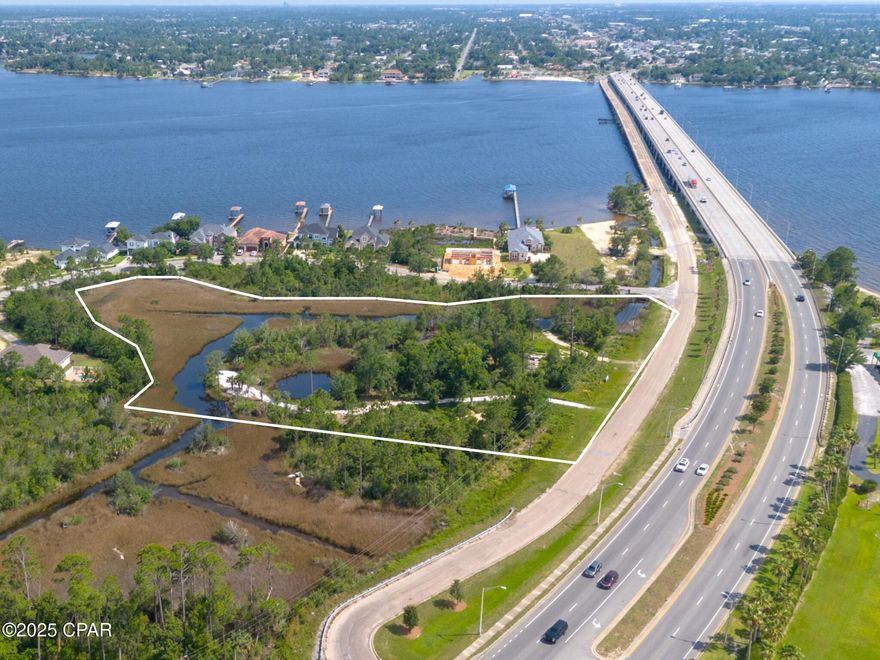 Beautiful property with island-like viewpoints. Spectacular site for a private estate or property can be split and a duplex built on each lot with beautiful bay and bridge views. Property is zoned mixed use so it may be used commercially as well Water and sewer lines go through the property. 4.58 Acres on the North East side of Bailey Bridge. Beautiful marsh and Bay views. There are wetlands and a small pond on the property. Seller has had property partially cleared and surveyed to split into two lots.  This listing is for purchasing the entire parcel.  11 townhouses could be built on property. /Approximately 1.3 r
short distance to shopping and medical care in Lynn Haven and Panama City and close to the beach and Tyndall Air Force base. Property is zoned for mixed use so residential or commercial development is allowed.