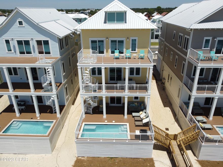 Pools and waterslides are now open for all homeowners and renters! Now is a great time to buy this luxury home at a newly reduced price. Margaritaville Beach Cottage Resort is one of the newest luxury developments in Panama City Beach. This beautiful Oasis floor plan features 3,784 sf of heated and cooled space. The views from all 3 floors are amazing as on one side you have a perfect view of the gulf where you can overlook the beautiful white sand beaches, waves, and of course the sunset every day. On the other side you can look out the windows and see everything the resort has to offer including the 425-foot lazy river, restaurant, poolside bar, poolside cabanas, hot tub, waterslides and more. This 6 bed, 6 1/2 bath home is perfect to live the resort lifestyle and/or to share that with vacationers from around the world through the rental program.