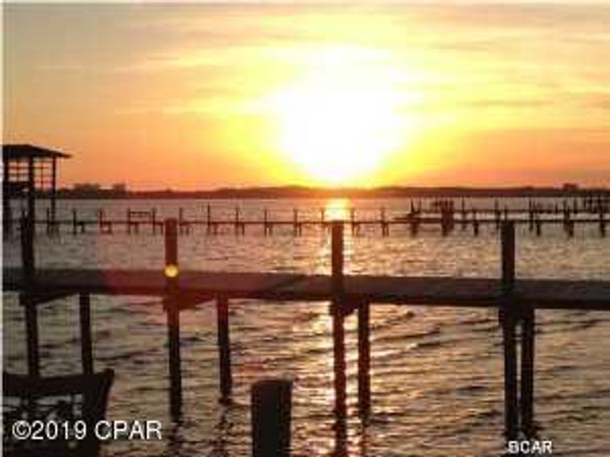 This boat slip #19 has a lift and the owner stated that the motors (2) are new. This slip is located just a short ride to Shell Island and Gulf access through the pass. A boat slip may only be purchased if you own a unit at Landmark. This slip will accommodate up to 28' boat. Buyer is responsible for verifying all information including dimensions.