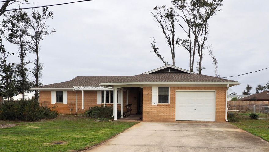 CURRENTLY UNDER CONTRACT, SELLER ACCEPTING BACKUP OFFERS Current market price adjustment on this well cared for move in ready brick home in nice, established subdivision. Located close to Tyndall AFB, schools, parks, shopping, and water activities.  New roof and the interior was just recently painted with a neutral color. All bedrooms are large with plenty of closet space and natural light. Lovely living room with a vaulted ceiling, wood beams, tongue in groove and brick walls. Toward the back of the house is a perfect hideaway family room to hang out in. There's a bonus room that can be used as a office, sewing, or craft room right next to the one car garage with opener. The laundry/utility room comes with a washer, dryer, second water heater and plenty of cabinet space. The kitchen is fu cabinets.  Large back yard and deck is kid and pet friendly with a privacy fence across back and chain link fences on the side. There is an irrigation well on the side of the house for watering and gardening. The wooden wheel chair ramp can easily be removed. This listing does not include the vacant lot next to the house. The vacant .34 acre lot MLS #693227 Parcel ID 24919-035-010 next to the house will be listed for $35,000. Owner's legal representative is a licensed real estate broker.