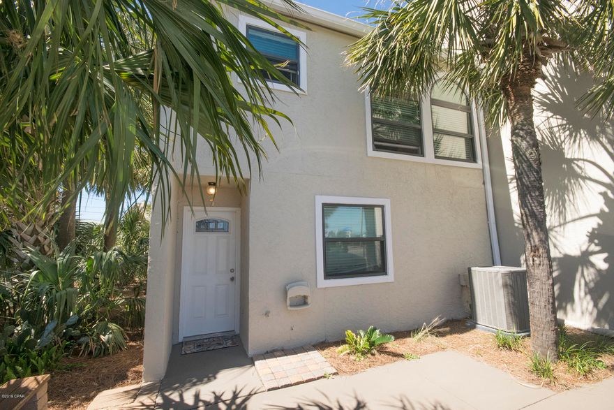 Currently under contract, seller is accepting back up offers. Location, Location, Location!  A must see before it's gone!  This 2 bed 2.5 bath unit is priced to sell fast. Hard to find a beautiful turn key town home this close to the beach at this price.  Close to St, Andrews park, shopping, restaurants, golf, and the Navy Base.  This unit sits on the corner of Irwin St. and quite Gulf Dr.  The unit has been updated with granite counter tops, hardwood floors in living area, tiled bedrooms, and stainless steel appliances, and new windows. It has 2 covered patios, one off the master bedroom, and 1 off the living room. The upstairs balcony and living room can be accessed from the back courtyard. These units are rare. Right across  from public access #5 on the worlds most beautiful beaches. A day at the beach, wash off in your outside shower &  relax. So many updates in this unit, replaced a/c 2 years ago, flooring 3 years ago, new windows less than 1 year old, appliances 3 years old. New stucco and paint just over a year ago. These units are rare, and are hard to come by. Right across Gulf Dr. to public access #5 on the worlds most beautiful beaches.  Leave the beach, come home to your own outside shower off the patio, and relax in a private landscaped courtyard to either enjoy the pool or just "hang out" in your own piece of paradise. Unit has outside storage for your beach/pool items.