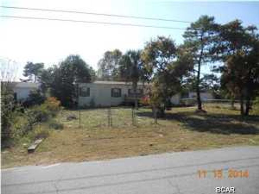 THERE IS POTENTIAL FOR THE RIGHT INVESTOR TO FIX THIS PROPERTY UP. THERE IS A INGROUND POOL ACTUALLY IN THE BACKYARD THAT COULD POSSIBLY BE MADE FUNCTIONAL AGAIN. WOODEN DECKS SURROUND THE PROPERTY BOTH IN THE FRONT ALL THE WAY AROUND THE BACK TO THE POOL AREA. THERE IS A YARD BUILDING AS WELL. INSIDE WILL TAKE ALOT OF WORK BUT POSSIBLY COULD BE SALVAGED.