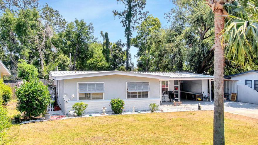 Currently Under Contract, Seller accepting back up offers.  UPDATED!  3BR/2BA Florida Cottage with pool & hot tub located in quiet Woodlawn subdivision. Plus the Florida Room has been enclosed for a beautiful den or playroom.  Near the Bay & and less than 10 minutes to the gulf.  Recent updates include:  Metal Roof, AC, all of home with porcelain flooring, Quartz countertops in kitchen, back splash, stainless appliances, painted inside, master suite has been renovated with tiled walk in shower with bench, quartz countertops and bowl sink, landscaping in front yard, pool pump & timer, well pump, new hot tub 2020, car port, & portable gazebo.  Outside of home has been painted recently.  Florida room has been enclosed for a great den area or play room.  Don't miss out on this one!