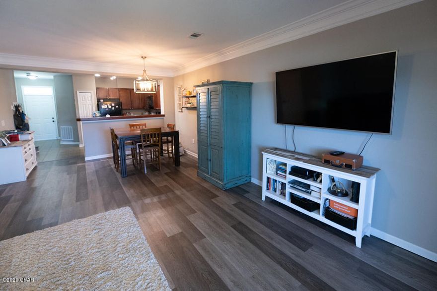 3 bedroom, 2.5 bath unit with a large floorplan. Downstairs is open concept living with beautiful new LVP flooring, crown molding, 9 foot ceilings, and sliding glass doors to the screened back patio facing the lake. There is also a bonus 1/2 bath downstairs for convenience. The large master faces the lake, has a walk-in closet, and of course an en suite with double vanity. All 3 bedrooms and the laundry room are upstairs. You'll see the same LVP flooring continues through to the bedrooms and hallways. Private parking in the attached single car garage and driveway space. The community has overflow parking available for your guest with a pass. This is a quiet gated community, with a clubhouse and swimming pool for relaxing in the summertime. If you are looking for a great place to call home  and be close to everything Panama City has to offer, this is an excellent neighborhood to do just that! Included with our unit is: Trash service and lawn maintenance; Will consider small pets with additional $300 non refundable pet fee and 2 pet limit. Private owners but must complete $30 screening/application process for ID verification.