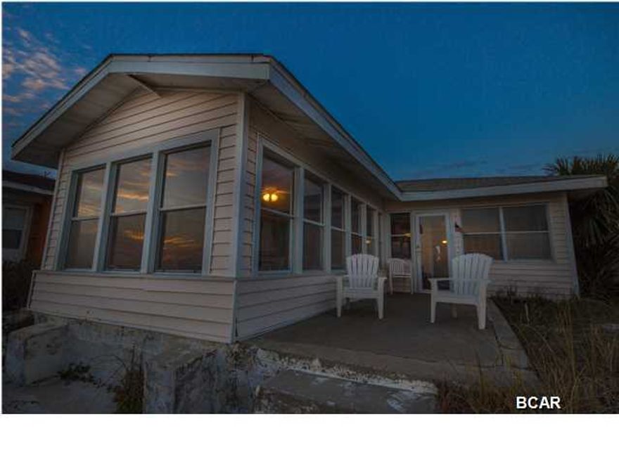 This is it!! The gulf front beach house you have been waiting to purchase for years. Now is the time!! This fabulous gulf front 3-bed 2-bath furnished house with magnificent views of the beach and the Gulf of Mexico. Large windows in the back of this house give you water views from the dining room, living room, and even two of the bed rooms. There is a grand back porch with glass all the way around with seating for many people to sit around and take in the beautiful beach and sunsets. This house sits way up on a hill high above the beach which will give it extra protection and also gives the spectacular views. This house is ready with almost everything you need, just bring a small suit case and stay for memorable times in your new beach house. There is even a 50 foot wide vacant lot