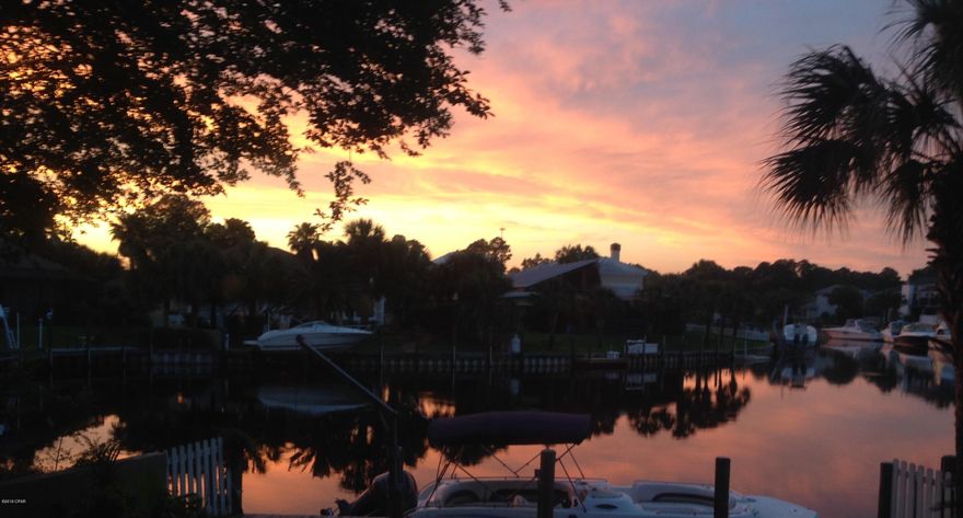 Currently under contract. seller accepting back up offers.

So much potential in this executive, waterfront home. Park your boat in your back yard with deep water access to Grand Lagoon, the bay and the Gulf. One of the BEST views in Bay Point as this home sits at the end of one of the canals. No looking right into your neighbor's yard. Lots of privacy. Bay Point is a gated community with roving security.  Open floor plan 12-14ft ceilings, etched glass doors, 18' tile throughout, granite counter tops. Brand new roof was just completed October 2019. Home is being sold As-Is and has Hurricane damage.