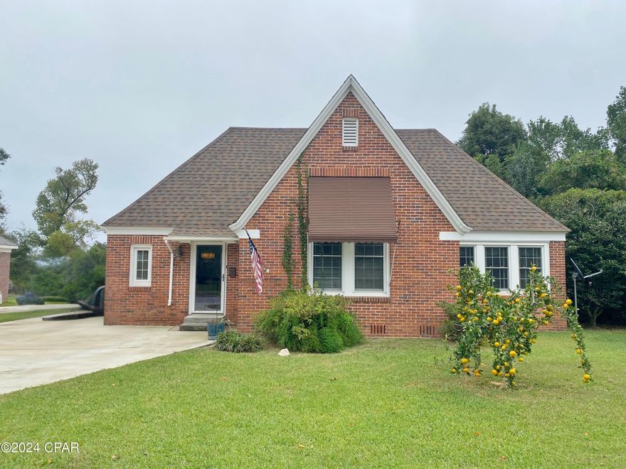 Charming Tudor-Style Home in the Heart of Downtown Marianna!

Step into timeless elegance with this charming 3-bedroom, 2-bath Tudor-style home, beautifully located in downtown Marianna, Florida. This unique property offers character and modern convenience, making it a true gem in today's market. As you enter, you'll be welcomed by the stunning exposed beams in the living room and the warmth of original hardwood floors that flow through the main level, exuding classic appeal.

The updated kitchen, complete with fresh white cabinetry, is both stylish and functional, connecting seamlessly to an indoor laundry area for added convenience. An extra all-seasons room provides a versatile space that's perfect for an office, cozy reading nook, or playroom.

Downstairs, two spacious bedrooms and two full bathrooms, along with a secondary living area, offer ample living space and flexibility. Upstairs, you'll find a private retreat with a large bedroom, walk-in closet, and a dedicated mini-split AC unit for personalized comfort. The main AC unit was replaced in 2022, with the mini-split updated in 2024, ensuring efficient and modern climate control.

Recent upgrades add peace of mind, with a 2019 roof, a 2020 tankless Rinnai water heater, and energy-saving gas utilities, keeping monthly bills budget-friendly—averaging just $130 for electric and $160 for water, sewer, and gas combined. Additionally, the seller has a previous survey available, helping to streamline the buying process and save you money.

This downtown beauty blends character, convenience, and value—schedule a tour today and see what makes this home truly special!