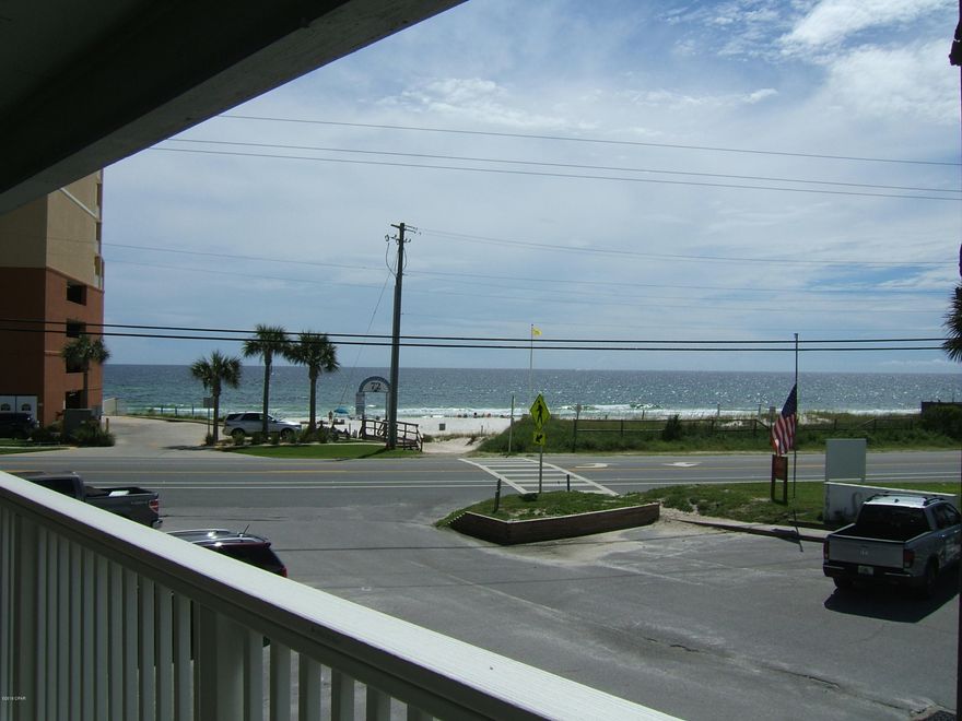 Rare building A unit at Southwind condominium with OPEN VIEW of Gulf which is right across the street from the beach. New HVAC, water heater, and SPECIAL ASSESSMENT OF $36,000 is already paid! Exterior of building getting makeover!HUGE master bedroom with a walk in closet (large enough to fit bunk beds).The unit is decorated with beachy charm and is rental ready. The open floor and large front porch (which extends the entire length of the unit)is just perfect for entertaining. There is also a back patio off of the second bedroom. The pool is just a few feet away and the beach access is very close. The location is brilliant! Pier park,30A & Carillon Beach are only minutes away. Unit is on second floor with a loft.