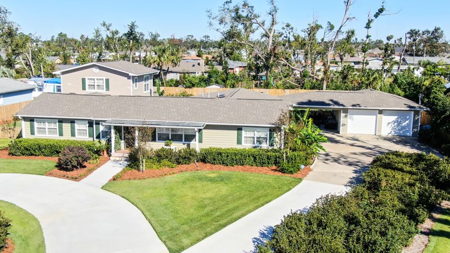 Pull into the driveway and you just know you are home. This amazing remodeled four bedroom, four bath home offers approx. 3100 square feet of living space in the always-popular Garden Club area and is a block from the beautiful St. Andrews Bay and its sunsets strolls. As you enter the foyer, you immediately notice the charming wood floors and the natural light. The living room is to your left as are a bedroom, the first bathroom and the home office with built-in cabinets and shelves. To the right is the formal dining room with original wood floors and built in cabinet and shelving. Down the hall is the second bedroom and second bath as well as the master suite.  There is a large sitting area as you enter the master bedroom, multiple closets, vaulted ceiling and master bath with raised vanity. The master bedroom also opens to the enormous utility room/craft room/art studio overlooking the back yard with a separate area for the washer and dryer. In the center of the home is the kitchen, open to the breakfast area, with solid surface counters, double sink and new stainless refrigerator with ice maker.  Opposite the master bedroom and also overlooking the back yard is the family room, added in 1998, with fireplace and built-in bookshelves. Above the family room is the fourth bedroom with full bath with jetted tub, vaulted ceiling and windows all around. Off the family room is the large screened porch. The back yard is huge and is also fully fenced. For parking purposes there is a detached two-car garage (with covered walkways to the house) that also has a large workshop area in the rear as well as a covered carport area and large circular drive. For your peace of mind, the sellers are offering a one year Home Warranty, there is a termite bond in place and the roof was replaced in March of 2019. Call your Realtor today for your personal tour.