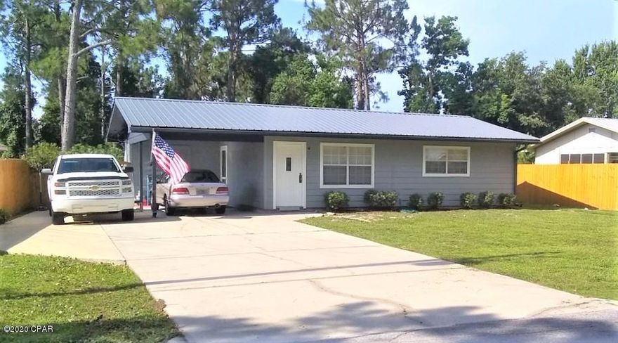 CURRENTLY UNDER CONTRACT, SELLER ACCEPTING BACKUP OFFERS-Metal roof and Hardy Board siding makes this a low maintenance, energy efficient home. This is a very cute home and perfect for a small family. Nice screened in Florida room, patio Large lot features a 30x20 shop perfect for many uses.  Laundry room. This property is off the main drag but has quick access to PCB PKWY and HWY 79.  Very close to the beach, Pier Park, the airport, shopping and restaurants.