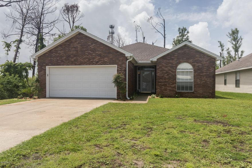 Move in ready 3BR/2Bath has had all repairs completed and awaiting its new owner. New waterproof vinyl FLOORS throughout the kitchen, dining room and living room and carpet in all 3 bedrooms. New ROOF and PAINT including the 2 car garage. All appliances will stay including washer/dryer.

Home has Nest security cameras installed as well as a Nest thermostat for ease and comfort. Living room and outdoor screened porch are wired for surround sound. Located close to Tyndall AFB and the central Panama City shopping area. No HOA and survey is available! (Measurements approximate, buyer to verify if important)