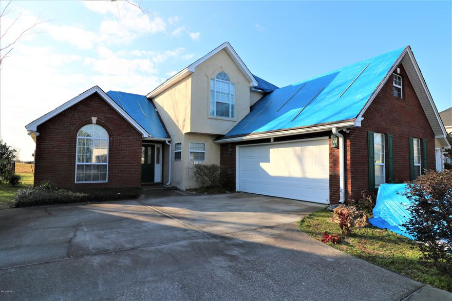 Great Opportunity to own a home in Panama Country Club! Great location very convenient to both Tyndall AFB and Navy Base not to mention all the fishing and water sports you can stand, AND our Beautiful Beaches!  Home features 4 bedroom 2 1/2 baths, formal dining, living room with fireplace, situated on a wonderful lot on the golf course.  Contract for roof repairs is already in place and new HVAC system installed. Home was damaged during Hurricane Michael, and being sold AS-IS.  Price is reflecting current condition, should seller have any additional work done the price may change.  Please call your favorite Realtor to schedule a showing. Thank you for considering this home! All information should be verified if important.