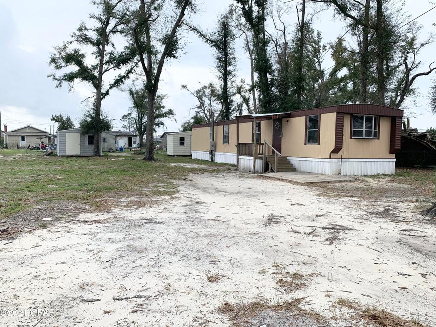 INVESTORS! Don't miss this opportunity! Perfect lot for TWO mobile homes! This lot has one modular home with nice appliances, newer a/c and rental-ready! This lot has 2 septic tank hookup and a deep water well with 2 utility sheds. Owner was renting at 575 a month. Never went up on rent after Hurricane Michael. Buyer to verify all measurements. Sold ASIS. Value is in the land.