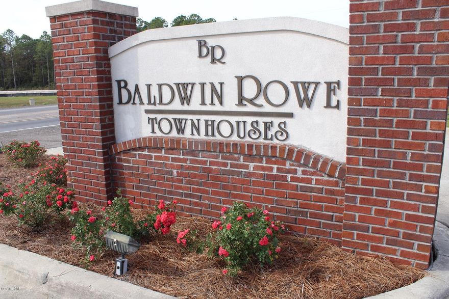 LakeFront Unit!  Super Floor Plan offering a Large Open Living area downstaris including Hardwood Floors, 9 ft. Ceilings, Granite Tile Counters and Crown Molding.  Upstairs has a Split Bedroom Plan with a den in the middle.  Baldwin Rowe is Fully Fenced and Gated at the Entrance.  Centrally Located, Priced Right!