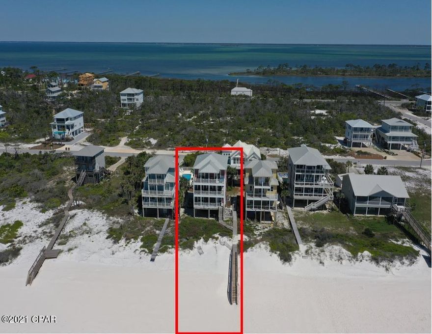Custom gulf front home on North Cape San Blas overlooking one of the nicest beaches around. This home was built to be a great investment/second home and it's been just that for years and has a proven rental track record. It's loaded with custom features and amenities throughout the 6BR's and 5.5BA's and comfortably sleeps 14. Lots of good deck space overlooking the beach and views are enjoyed throughout the home. The elevator goes to all floors and this home is part of a 4 home HOA that share a community pool. Being sold fully furnished and equipped. Home is rented solid through September and can only be shown during turns on Saturdays. Buyer must honor the rental agreement with Cape and Coast. Interior of the home has been newly repainted since these interior pictures were taken. One of the owners is a licensed Realtor.GRI-$160K