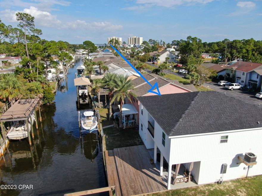 Welcome to this beautiful 4-bedroom, 2-bathroom water-front home of your dreams! In this gated community this home will make the perfect short term rental investment, vacation getaway, or even the perfect primary home!
As you step inside, you'll be greeted by an inviting open-concept floor plan that seamlessly blends the kitchen, dining, and living areas. The kitchen is a chef's dream, featuring top-of-the-line appliances, sleek countertops, and ample storage space. With its large windows and sliding glass doors, the living area offers natural light and provides unobstructed views of the canal that leads you directly towards the Bay and Shell Island!

Each of the four bedrooms are generously sized and designed with comfort in mind. The master suite offers a private en-suite bathroom, complete with modern fixtures and finishes. The remaining bedrooms are versatile, ideal for accommodating family members or guests.

One of the standout features of this property is the expansive garage, providing abundant space for multiple vehicles, storage, or even a workshop.

Outside, the property's natural surroundings take center stage. The backyard is a serene oasis, offering a peaceful escape with the canal as its backdrop. Imagine relaxing on your patio, taking in the picturesque views!

Don't miss the chance to make this exceptional property yours!