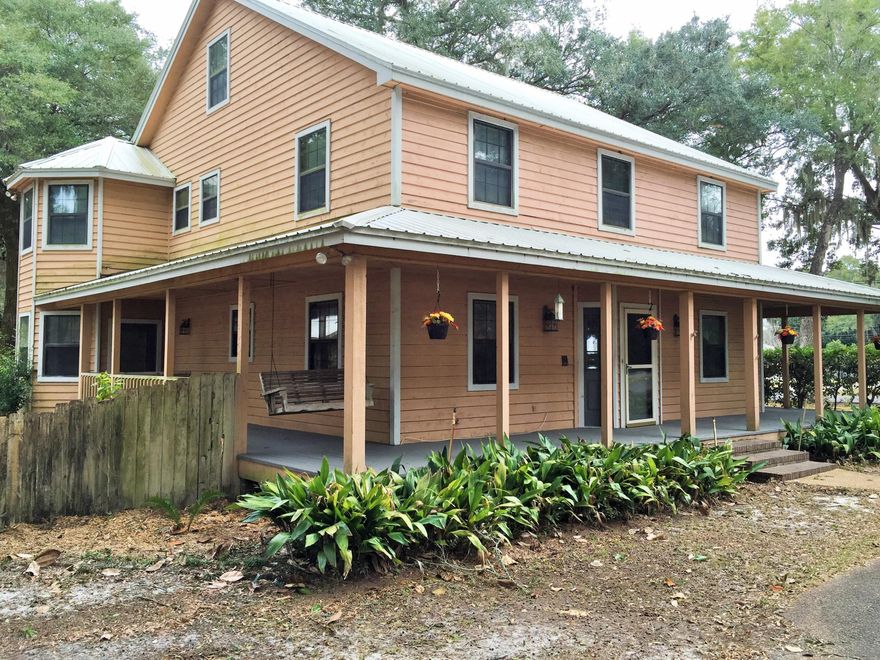 Huge house on corner lot with a ton of amenities. This home has 4 full bedrooms and 4 full baths. The kitchen is HUGE with exposed brick and a large kitchen island. Living room has sitting area with wood laminate and plenty of room to entertain. There is a bedroom downstairs and a full bath. The second floor has 2 large additional bedrooms and a large master suite with a spacious master bath with a soaking tub. On the third floor there are 2 large bonus rooms. House has new carpet and paint on the inside. Located on a corner lot there is plenty of room for RV and boat storage. Detached garage gives you plenty of room for storage. Please call for your private showing. Please verify all measurements, information and square footage.