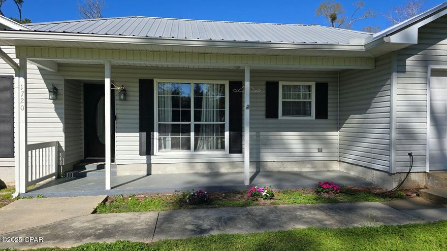 Charming 3-Bedroom Ranch on 2.52 Acres is move in ready! Recent repairs have been completed that were noted on the home inspection report and it's ready for all types of financing and insurance.    
Discover your perfect retreat in this spacious split-bedroom floor plan featuring three bedrooms and two baths. The open-concept layout welcomes you with an abundance of natural light and a cozy wood-burning fireplace, perfect for gatherings. Enjoy cooking in the brand-new kitchen with sleek cabinets and modern finishes.  Step into the sunroom, which leads to a covered deck, ideal for BBQs and relaxing outdoor moments. The attached garage offers convenience, while the 36x24 pole barn provides ample space for hobbies or storage.  The expansive lot includes a chain-link fenced backyard, a wet weather pond with a dock, and room for your garden or animals. With three road access points and just a short drive to Highway 231, you'll enjoy easy access to Panama City and the beautiful beaches.