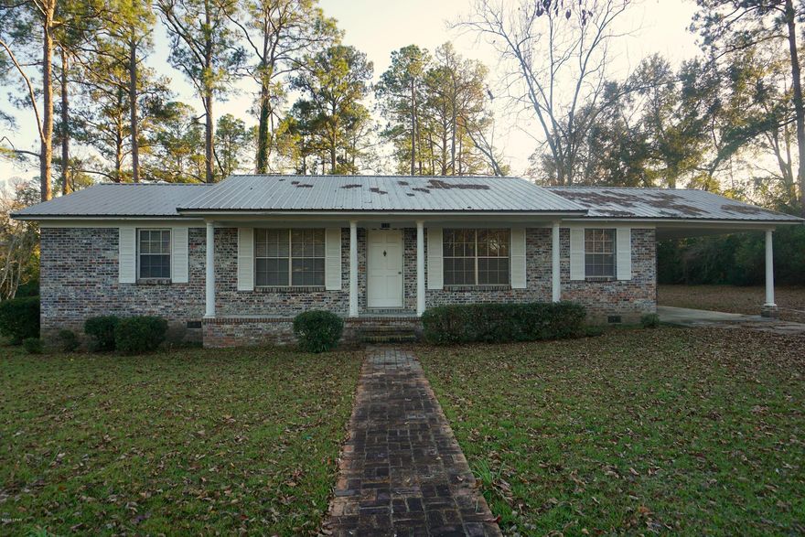 Charming 3 bedroom, two bathroom brick home in downtown Graceville. This home features two large livings spaces, dining room, an open kitchen, large laundry room, carport and storage room. The home sits on a large lot with nice landscaping. The home is located close to restaurants, schools, college, and shopping. The home has been used as a rental most recently so it would make a great investment property also.
