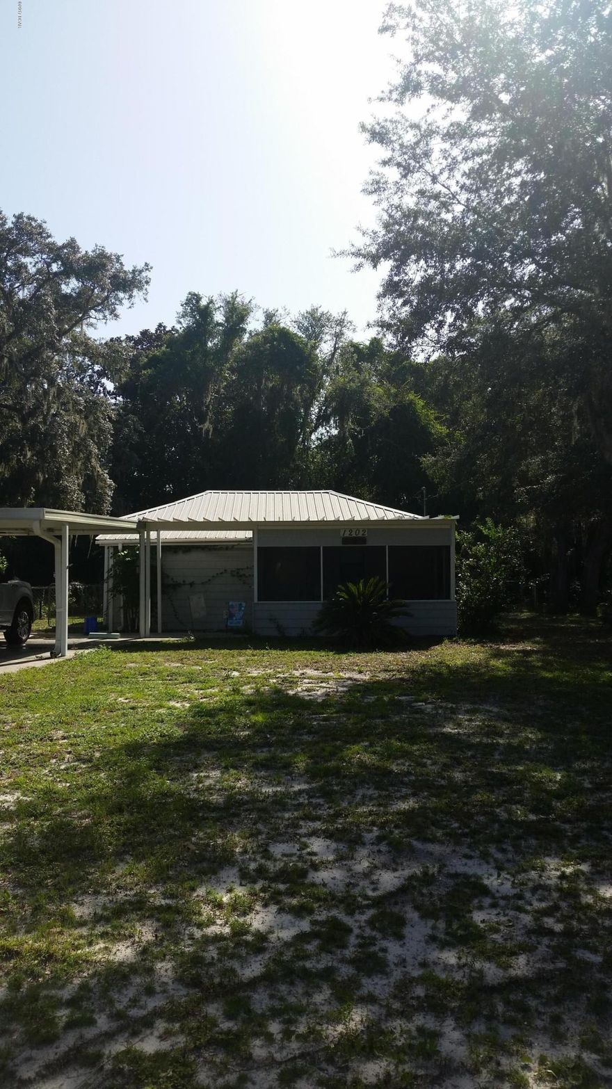 Just across the street from the bay!  Precious floirda cottage just waiting for a new owner!  Large corner lot with nice area for an RV--has electrical connections.  There is a nice out building as well. Perfect for a getaway cottage or a rental.
