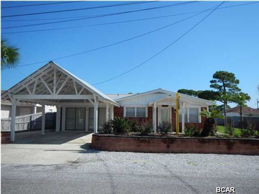 This home is in a great location off Thomas Drive on Panama City Beach. The home sits on a lot and a half, 75' x 125'. One block to the lagoon and 2 blocks to the beach. This property is nicely landscaped with an open patio with brick pavers. New roof, new windows, crown molding, chair rail, new A/C unit. The entire property is fenced in. Workshop in back yard is insulated. This property has ample space for your RV, boat, travel trailers, jet skis, etc. Great second home or rental investment. The home is being sold furnished and sleeps 8 - 10.