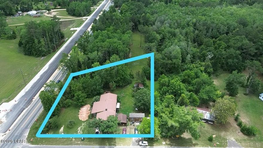 This 3-bedroom, 1-bath home with a spacious 2-car garage sits on a generous 0.87-acre lot in the quiet town of Wausau. Offering a blank canvas for your vision, this property is perfect for investors, handy homeowners, or anyone looking to create their ideal Florida retreat.

The home features a durable metal roof that provides excellent longevity and peace of mind. Recent updates to some of the electrical wiring and some of the plumbing mean some of the heavy lifting has already been done, giving you a solid foundation to build upon. While the interior needs cosmetic and functional work to bring it fully up to date, the structure is ready for your personal touch--whether you're envisioning a modern farmhouse, cozy family home, or rental property.

Inside, you'll find three bedrooms and a functional layout that maximizes the space. The large 2-car garage offers convenient parking and additional storage or workshop space. Outside, the nearly one-acre lot provides room to roam, garden, add a workshop, install a pool, or simply enjoy the privacy and country feel. 

Wausau offers convenient small-town living with a Dollar General, local restaurant, and convenience stores just minutes away. The property is only 15 minutes from the City of Chipley for additional shopping, dining, and services, and less than an hour from the beautiful white-sand beaches of Panama City Beach.

This is a rare opportunity to own a home with strong potential in a peaceful setting.