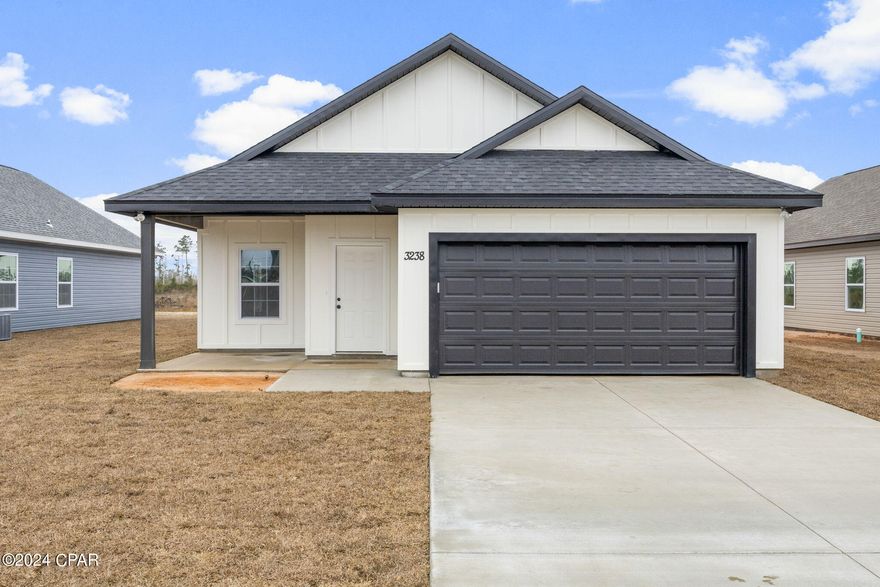 *Seller offering $5,000 towards buyer's closing costs with acceptable offer* Brand new construction on Ten Acre Road! This 4-bedroom, 2-bathroom home offers a backyard with a sprinkler system and stainless-steel appliances. It features a master bedroom on the first floor with a walk-in closet and double vanities in the master bath. Luxury vinyl plank flooring is throughout the entire first floor including the bedrooms. Additionally, it boasts a bonus room, ideal for flexible use. Exterior front is Hardie board, and the sides/rear are Vinyl. Conveniently situated for access to Panama City and Tyndall Air Force Base, this home provides both comfort and convenience. Buyer to verify all measurements and any important information.