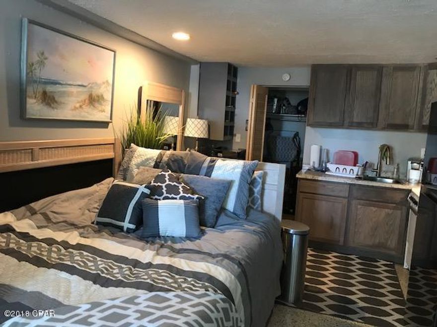View the sunset on this 4th floor unit.  Unit is furnished.  Amenities include indoor pool, covered and uncovered decks, bbq grills, owners lounge, elevator and recently updated exterior.  COA fees cover water, pest control, cable, internet and electricity.