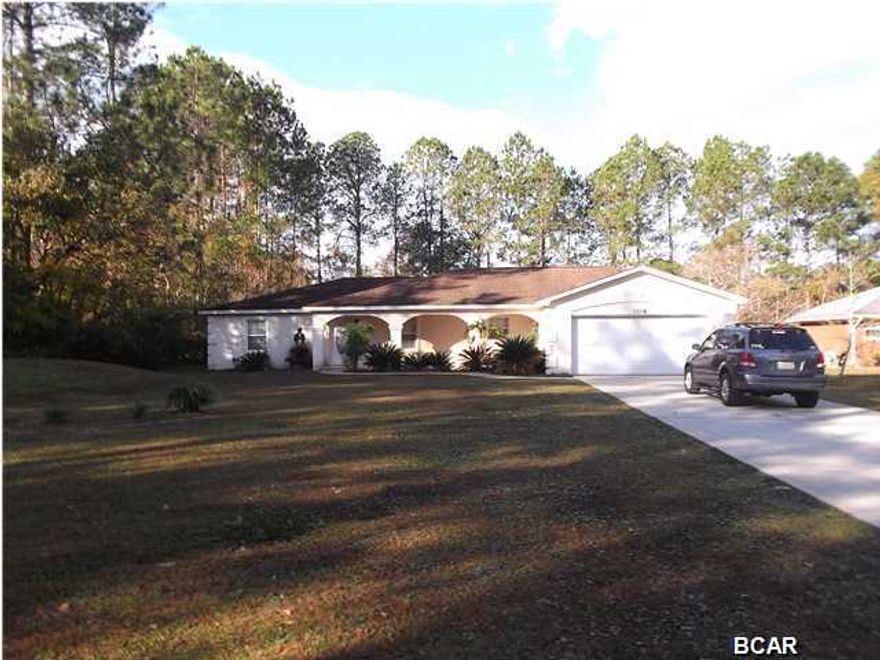 Spacious home with split bedroom floor plan. Privacy fenced back yard with shed. Close to Tyndall AFB, shopping and schools. On well water. Key in office.