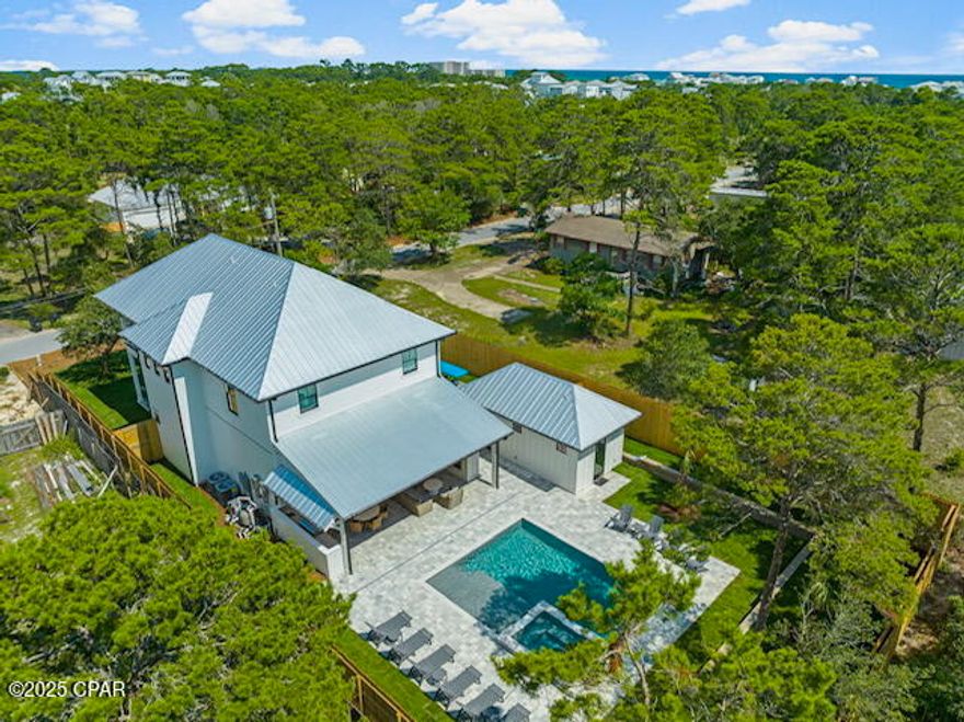 CURRENTLY UNDER CONTRACT, SELLER WILL CONSIDER BACKUP OFFERS. Ultra-Custom Inlet Beach Retreat
5 Bedrooms | 5.5 Bathrooms | 3,000+ Sq Ft | Private Pool & Hot Tub | Detached Garage & Full Bath | Fully Furnished | $200K+ Annual Income | No HOA | Prime Location.

Welcome to your private sanctuary in Inlet Beach, where sophisticated design, resort-style living, and an unbeatable location combine to create the ultimate coastal retreat. Whether you are seeking a luxurious second home or a top-performing vacation rental, this residence delivers in every way. Designed with comfort, style, and durability in mind, every detail of this home reflects thoughtful craftsmanship and timeless elegance.

Interior Highlights:
* Spacious open-concept floorplan perfect for gathering and entertaining
* Large designer chef's kitchen with Taj Mahal quartzite, oversized island, walk-in pantry, stunning tile & design
* Custom millwork throughout every room, plus select antique doors for added charm
* Professionally styled premium furnishings (sold fully furnished!)
* Thoughtfully designed built-in bunk room ideal for kids or guests

Resort-Inspired Outdoor Living!
Step into your own private backyard oasis—a resort-style saltwater pool with sundeck, oversized hot tub, and a fully equipped outdoor kitchen under a covered patio. The outdoor gas fireplace, lush landscaping, and ample seating areas make it ideal for entertaining year-round. Detached garage with extra storage for golf carts, bikes, and beach gear. Beautifully appointed outdoor pool bath for guest convenience. Spacious paver driveway with lots of parking.
Covered front porch and rear patio perfect for multiple relaxing areas.
Surrounded by mature palms, live oaks, and a manicured lawn. 

Unmatched Prime Location:
* Perfectly positioned in a peaceful, upscale enclave of Inlet Beach  
* Direct beach access (straight down the street)
* A short walk, bike, or golf cart ride away * Adjacent to Camp Helen State Park—enjoy fishing, paddleboarding, canoeing, and nature trails
* Moments from Rosemary Beach and all the shopping, dining, and energy of 30A. Enjoy the rare combination of peaceful privacy with vibrant beach town living!

Investment & Quality Highlights:
* $200K+ annual short-term rental income
* No HOA
* Built to high standards with low maintenance in mind
* Hurricane-impact windows & doors
* Energy-efficient spray foam insulation
* Structured wiring for modern tech
* Metal roof, Trex decking, and Hardie exterior for long-term durability
* Dual tankless water heaters & irrigation      well system

Luxury, Location, and Long-Term Value—All in One! From its stunning design and top-tier finishes to its income potential and beachside location, this home is more than a property—it's an opportunity.

Turnkey, high-performing, and unforgettable!! Don't miss out on this RARE GEM!