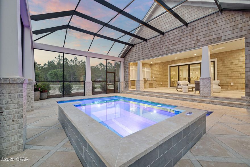 Situated on a beautifully landscaped homesite in the gated community of Wild Heron, this new construction home offers 2,785 square feet of heated/cooled living space and 4,963 square feet under roof, with a private pool, screened-in lanai, and refined finishes throughout. Thoughtfully designed for both everyday living and entertaining, the home includes 10' ceilings on the first floor, vaulted cypress wood ceilings in the living room and primary suite, and an open-concept layout filled with natural light. Built by Focus Construction and designed by Coastal Architects, this custom residence showcases exceptional craftsmanship and attention to detail. Interior features include solid core doors, floating bathroom vanities with under-cabinet lighting, Delta black plumbing fixtures

black accent hardware, and custom shaker cabinetry. The chef's kitchen is outfitted with premium Thermador appliances and seamlessly connects to the main living and dining areas.

The spacious primary suite offers a tranquil retreat with vaulted ceilings, a walk-in closet, and a beautifully appointed en-suite bath. Additional highlights include a large covered entry with brick detail, real cedar shake siding, exterior gas lanterns, and a massive two-car garage with extra storage space.

Step outside to your private oasis: a screened-in pool enclosure with a heated pool and hot tub, covered lanai with gas fireplace, outdoor kitchen, and custom louvered millworkall surrounded by a peacock paver pool deck and lush landscaping with low-voltage lighting.

Wild Heron is a 734-acre gated neighborhood located on the shores of Lake Powell, Florida's largest coastal dune lake. Residents enjoy access to top-tier amenities including a community dock, fitness center, resort-style pool, boathouse, and Shark's Tooth Golf Club membership optional. For water enthusiasts, property owners can lease long-term, low-profile boat slips with power liftsdesigned for vessels up to 24 feet subject to availability. Whether you're into paddleboarding, wake surfing, or a sunset cruise, Lake Powell is just steps away.

This home offers the perfect combination of luxury, comfort, and access to one of the Emerald Coast's most scenic and well-appointed communities.