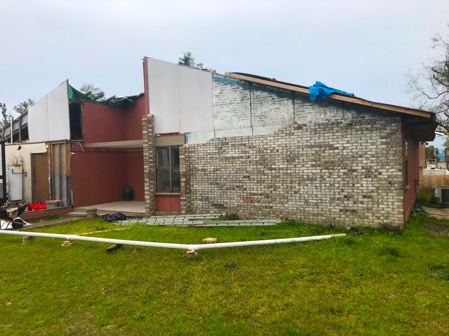 GREAT fix & flip or investment opportunity with this 3 Bedroom / 2 Bathroom in the sought-after Callaway Forest neighborhood in Panama City! This brick home, built in 1986, is 1,670 sqft. (heated) and 2,493 sqft. (total). The interior of the home has some wonderful features including vaulted ceilings with solid wood beams, a stone fireplace, large kitchen, etc., and the home sits on a cul-de-sac - so nice and quiet, with great neighbors! The home was damaged from Hurricane Michael and will require repairs including the garage, drywall, etc. but AT THIS PRICE IT IS A STEAL! Personally I think this home is screaming for a farmhouse renovation! Don't wait because this one WILL NOT LAST LONG!     ----- CASH BUYERS ONLY -----