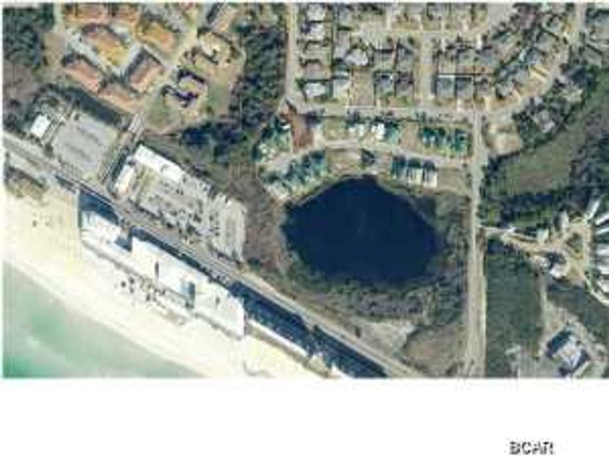 Pretend you don't know much about our area. Summer Breeze is a very popular subdivision on the west end. This particular vacant lot in the awesome neighborhood is VERY desirable because it one of the few lots that has room to build a pool too. Your 2 or 3 story future home would have great potential for fabulous views being only a few steps to the lake and also to the Gulf- Two views from one location! Only one block to the beach, build your dream home today! Ride by and check it out!