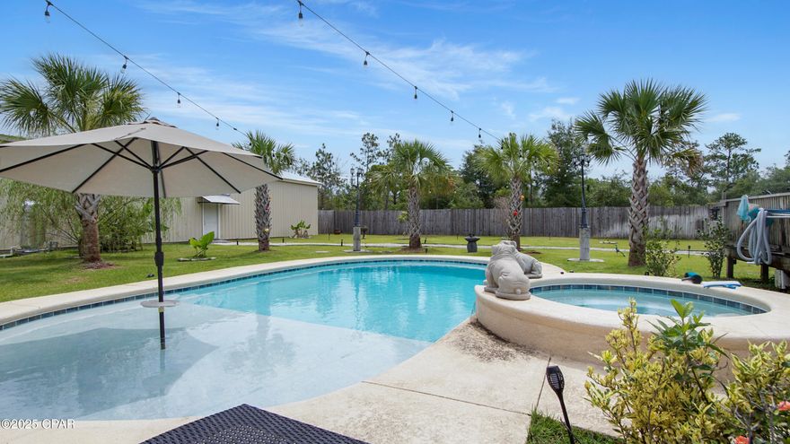 Oasis in the 'Hills! This property has everything you could ever need and is priced below recent appraisal. The over 2,300sf primary home features 4 large bedrooms, 2 baths with an amazing Primary area that has an office, man cave, and an over-sized Primary bathroom with a 6ftx6ft 8 head shower! Newer roof, 5 ton HVAC, 2 21 seer mini splits, 2x6 framing, stainless steel appliances, fully wired stereo system, ADT security system, and whole house generator. Off the main house are a 14x42 covered porch & 24x16 deck. 
Escape the summer heat in the fully automated in ground pool with a sun shelf! The pool is heated with a separate hot tub for chilly night swimming as well.
Have guests? The pool house has a complete kitchen, living area, and full bath.  The 2 story dog kennel is completely finished, plumbed, heated & cooled.  Perfect if you need to convert for another residence on the property.
Auto enthusiasts will love the monstrous, fully insulated, 5 bay shop! This is complete with a tire machine, 9,000lb lift, and 10 ton HVAC. Beside this shop is a 24x36 shop that is insulated and has a HVAC as well. 
There are 2 50amp RV hook-ups, producing fruit trees, 2 electric  entrance gates, and so much more. This property has everything! Located only 45 minutes from Panama City. All measurements are approximate, verify if important.