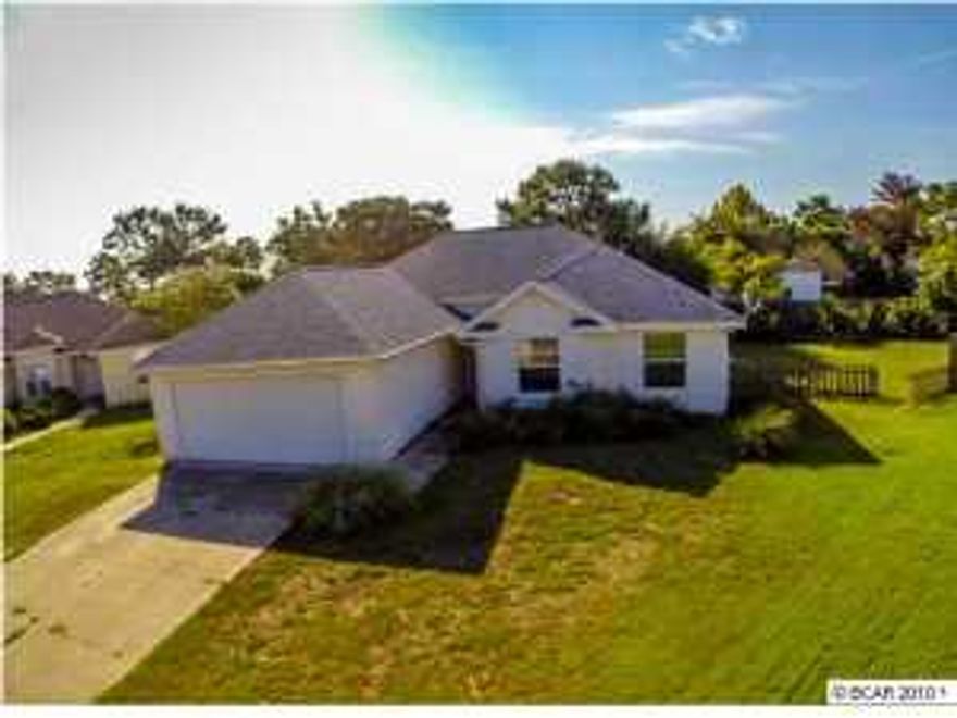 Ranch style home with stucco exterior finish and asphalt shingle roof. Front door entry is open to dining room, living room and kitchen with access to Master bedroom and two additional bedroom to the right. Home also features a large lot and located on a cul-de-sac.