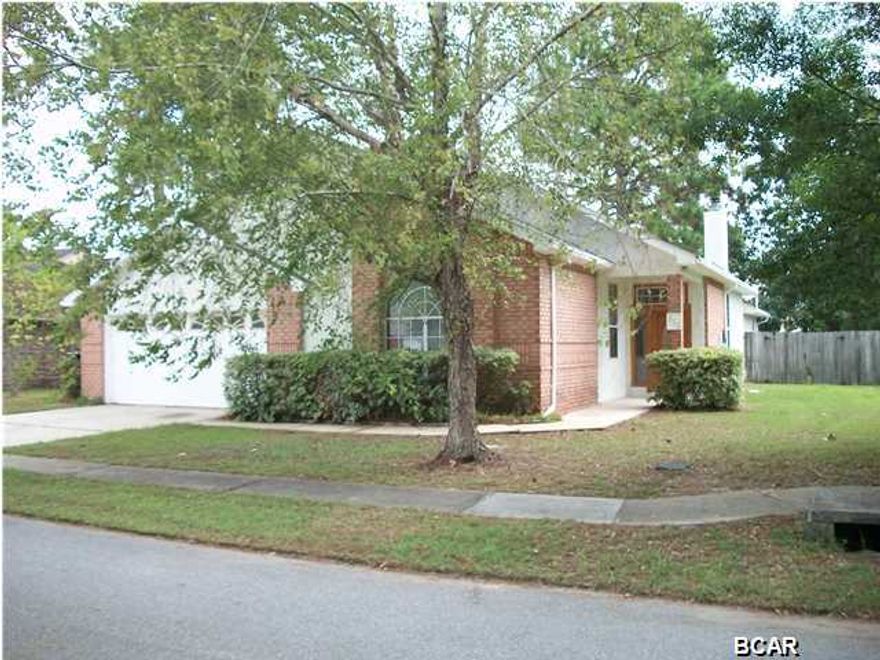 If you're looking for the perfect home, in a great neighborhood this is the one. Located near Tyndall Air force Base and only a short drive away from everything. This 3 bedroom 2 bath home with 2 car garage,has a wonderful open split floor plan. With its large screened in back porch, automatic irregation system with separate well, spacious privacy fenced back yard it is a great place to bbq with friends and family. As you walk through the door, the open spacious living room with its high ceilings, lovely brick fireplace and meticulously maintained appearance of this home are sure to impress. The entire interior has been newly painted and you will feel as though you're in a brand new home. Large Bedrooms, ample storage space, plenty of cabinet space in the Kitchen are some of the