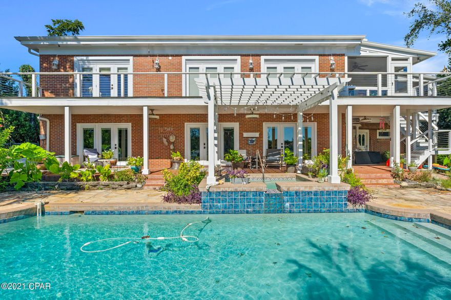 Cove home on deep waterfront.  New dock, boat lift and fence. The open great room overlooks the swimming pool and bayou. The charm of this home has the warmth and character you don't find in new built homes. Some of the upgrades are resurfaced gunite swimming pool, automatic shades/blinds in great room; new 5 ton Daikin 18 seer inverter A/C system and spliter A/C in kitchen.  The 2 bedrooms and family room in basement would make a great in-laws quarter.