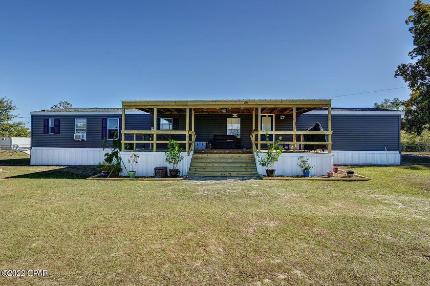 CURRENTLY UNDER CONTRACT, SELLER WILL CONSIDER BACKUP OFFERS$10,000 SELLER CREDITS towards price or closing costs if UNDER CONTRACT by Friday, JAN 13th! This beautiful property is perfect for the family that likes the country life near our towns and beautiful beaches! The home is originally a 3 bed/2 bath and has 4th flex space and den built on. Brand new covered patio decks on the front and back to sit in your chair, sip your morning coffee and read the news.  The most intriguing and interesting feature is a 10 x 10 underground storm shelter so you're always prepared for Florida's weather! A large shed has been built out back, waiting to be turned into your new man cave or she shed! But wait, there's more! Have you always wanted chickens and your own fresh eggs? This property is for YOU!