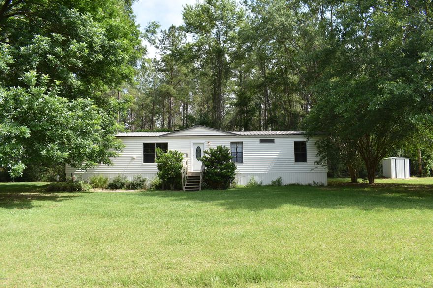 CURRENTLY UNDER CONTRACT, SELLER ACCEPTING BACKUP OFFERS! This mobile home would make the perfect dream home for the avid hunter and is located in a peaceful country setting on 37.5 acres! It has a creek located on the property with approximately 6 acres cleared and the remainder wooded. Mobile home has been freshly painted and has new black appliances, (side by side refrigerator w/ice maker and glass top stove).  There have been many updates to include a metal roof, ac/heat pump, laminate flooring, new vanities in both baths, granite counter-top in master bath, new roof on pole barn, and a new shed for the well.  Owner financing is available.