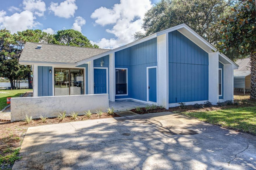 WATERFRONT ON GRAND LAGOON and and close enough to the ocean to keep the rest of the family happy!! Boat Owners dream house - bring your boat and you are just minutes to Shell Island, the jettys, and the Gulf of Mexico or boat, tube, and fish in the Lagoon.    Open floor plan, 3 BR, 2BA waterfront home.  Newly renovated and ready for move-in, new paint inside and out, new kitchen cabinets and stainless steel appliances, new master bath, new tile floors and newer roof.  Seller has permit for dock in hand.  Located on beautiful South Lagoon Drive, a quiet, low traffic street that meanders along Grand Lagoon. 3 block walk or bike ride to beach.