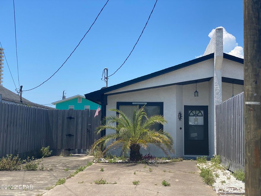 CURRENTLY UNDER CONTRACT, SELLER WILL CONSIDER BACKUP OFFERS - LOCATION LOCATION LOCATION PLUS BRAND NEW ROOF, BRAND NEW A/C SYSTEM AND BRAND NEW WATER HEATER Adorable retro beach house within 2 small blocks to a dedicated beach access and also to the Grand Lagoon.  This one bedroom is clean, partially furnished and would make a great personal retreat or profitable short term rental.  No HOA fees.  The fully fenced back yard is very private for beach life and is very low upkeep with storage shed for extra storage.  There  is a large covered back porch that can be enclosed.  Located on a quiet street conveniently five minutes to St Andrews State Park, local restaurants, marinas, entertainment and shopping   Call to see today!