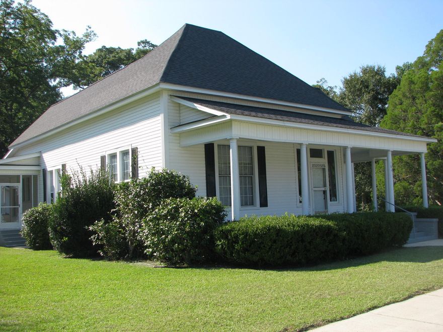 Beautiful historic home in downtown Chipley, Florida. This home has the charm of an older home, with the amenities of a newly built home!  The sellers have just installed new carpet, refinished the original hardwood floors, and repainted the entire home & it shows.  This home has character, plus a huge master suite with spacious walk-in closet, nicely appointed laundry room/mudroom, gracious eat-in kitchen, & built in bookshelves.  Outside you will fall in love with the deep front porch & large screened back porch; both are perfect for enjoying this 1.77+ acre lot. The lot runs from block to block, & you can access the 2 car garage w/ added storage space from the back. This home is move in ready with a newer roof, brand new flooring, & updated kitchen. It's a must see property!