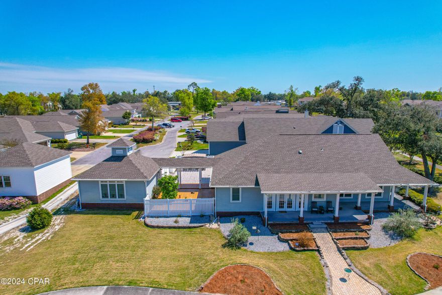 Welcome to one of Panama City's most sought after communities.  This gorgeous cottage boasts 3 bedrooms with 2 1/2 baths located on a corner lot. A beautiful kitchen & the living room with a fireplace offers a spacious open floor plan.  You can entertain guests or have family gatherings to build years of memories that will last a lifetime. 
As if it couldn't get any better...the media room has an 84 inch screen and projector with state of the art sound system for hours of entertainment. 
New roof 5 years old. Custom built garage cabinets, finished attic in house and garage includes wrap around deck and covered Pergola in  the courtyard.  Large privacy fence with beautifully maintained lawn and landscaping. The sprinklers are fed by independent water well. HVAC replaced in 2017 and hot water heater in 2021.  
This paradise embodies...
Community Pools, Entertainment Room,  Gym, Dock, Fishing, Kayaking, Gazebo, Pavilion, Game Room, Playground, Basketball, etc. 
This property is pleasing to even the most discriminative taste.
The urgency?  It's a unicorn.