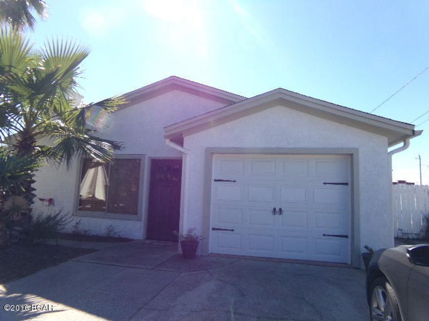 FANTASTIC BEACH COTTAGE * across from the lagoon * walk to the beach * near restaurants and amusements * large great room with tile floors and fireplace * kitchen includes all the appliances with breakfast bar and room for a dining table * tree wonderful bedrooms plus a bonus extra bedroom or could be used as a rec room * the yard is fenced and easy to maintain * this is a fantastic property to use as a full time home home, second home or great investment rental.  You will love seeing this property.