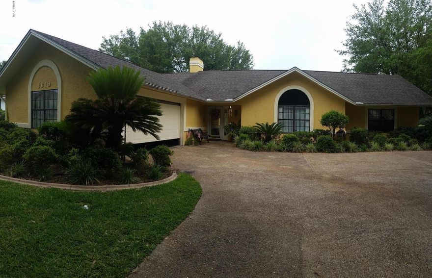 THIS IS A BEAUTIFUL HOME LOCATED ON THE 12TH HOLE OF THE GOLF COURSE. THERE IS A HUGE POOL WITH A DIVING BOARD AND A PERGOLA IN THE FENCED IN BACKYARD! THE YARD IS OUTSTANDING! IT FEATURES A GARDEN IN THE BACK, MANY PLENTIFUL FLOWER BEDS, SHADY TREES IN THE FRONT AS WELL AS A DEEP WATER WELL FOR THE IRRIGATION SYSTEM SO BRING YOUR GREEN THUMB! THIS IS AN UPGRADED 3 BEDROOM, 2 BATH HOME! THE BIG MASTER BEDROOM HAS A SLIDING DOOR LEADING TO THE BACKYARD AND THE MASTER BATH HAS BEEN UPDATED AND HAS HIS AND HER SINKS, A SEPARATE MAKE-UP VANITY FOR HER, A STAND UP SHOWER, A GARDEN TUB, 2 WALK-IN CLOSETS AND LINEN CLOSET. THE OTHER 2 BEDROOMS ARE BIG ENOUGH TO HOLD KING SIZE BEDROOM SETS AND BOTH HAVE 2 CLOSETS. THE 2ND BATHROOM HAS BEEN UPDATED AS WELL AND ALSO HAS DOUBLE SINKS AND A LARGE STANDUP SHOWER. THERE IS A WOOD BURNING FIREPLACE IN THE LIVING ROOM, SLIDING GLASS DOORS THAT OPEN ONTO THE BACK PATIO/POOL AND DOG DOOR FOR YOUR FUR BABY. THE KITCHEN FEATURES BLACK APPLIANCES, A DOUBLE OVEN, REAL WOOD CABINETS, GRANITE COUNTER TOPS, A LOVELY TILE BACKSPLASH AND A COUNTER HEIGHT BAR. THERE IS TILE IN THE DINING ROOM, KITCHEN, DEN, BATHROOMS AND LAUNDRY ROOM; WOOD FLOORING IN THE LIVING ROOM AND HALL; CARPET IN THE BEDROOMS. THE FINISHED 2 CAR GARAGE HAS A PLACE TO PARK YOUR GOLF CART AND A PLACE FOR YOUR DEEP FREEZER. THE ROOF WAS REPLACED IN OCTOBER 2013 AND THE WATER HEATER IS ABOUT 6 MONTHS OLD. THIS HOME IS MOVE IN READY! **ALL SIZES ARE APPROXIMATE AND SHOULD BE VERIFIED**