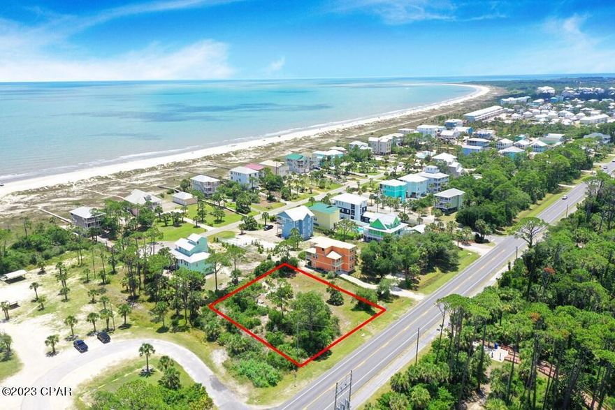 Large, high lot with ample space to build within the x flood zone. Views of the bay and the gulf, with access to each through Salinis Park, directly south of the lot. You can legally drive your vehicle to the beach through Salinis, if the vehicle is permitted to drive on the beach. Lot also has deeded access through Two Palms subdivision. Plenty of recreational activities across the street, including kayaking, kids playground, volleyball court and two pickleball courts. Two Palms has some building covenants, but not too restrictive( or costly). The homes are all well built and appointed. Listing agent is related to seller